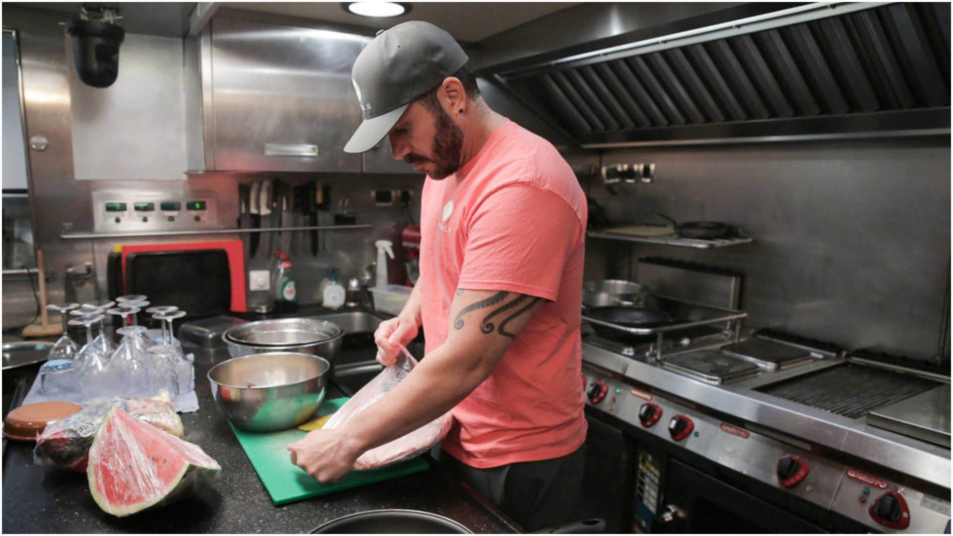 Chef Marcos Spaziani from 'Below Deck Sailing Yacht' in the galley kitchen beginning to prep for dinner 