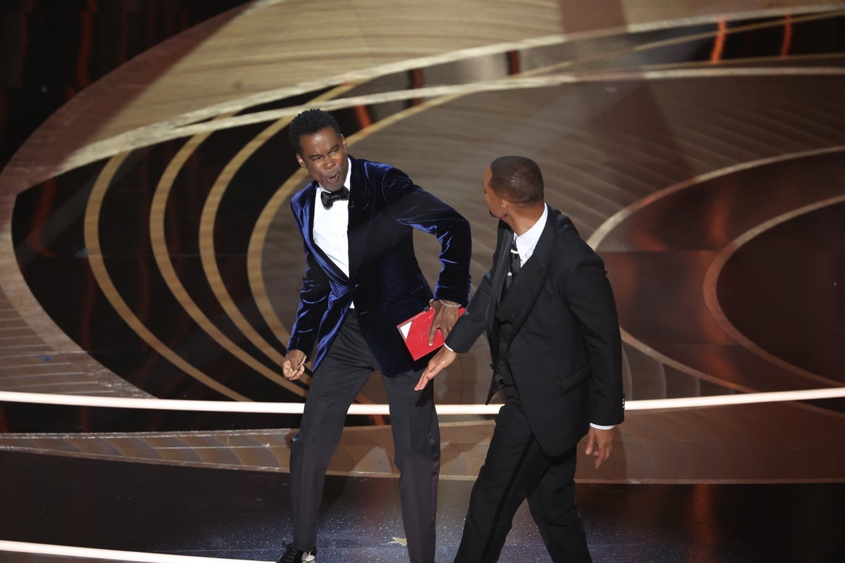 Will Smith slaps Chris Rock onstage during the show at the 94th Academy Awards