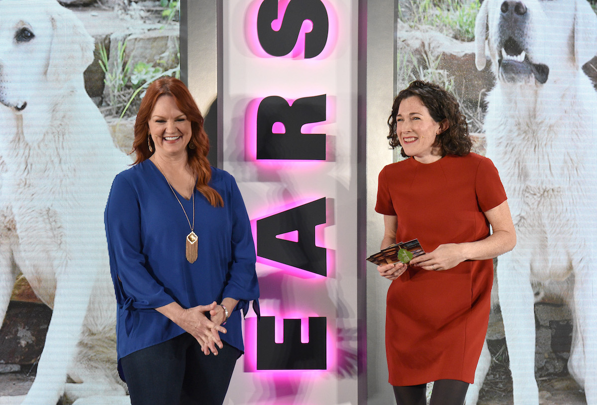 Pioneer Woman Ree Drummond wears a blue shirt standing near Maile Carpenter in a red dress at Heart Magazines' Unbound Access MagFront