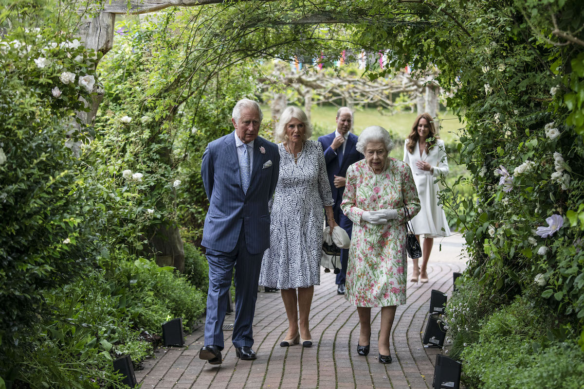 Prince Charles, Camilla Parker Bowles, and Queen Elizabeth II walk in front of Prince William, and Kate Middleton