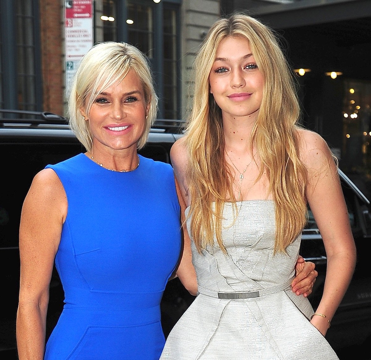 Yolanda Hadid and Gigi Hadid pose together and smile.