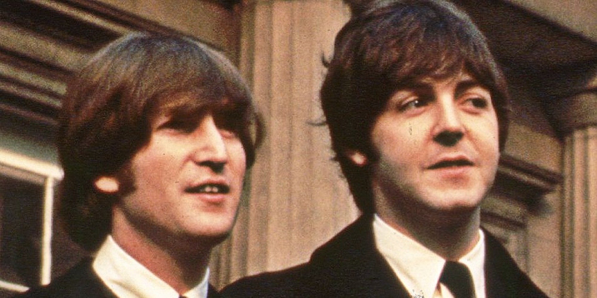 John Lennon and Paul McCartney pose for a photograph.