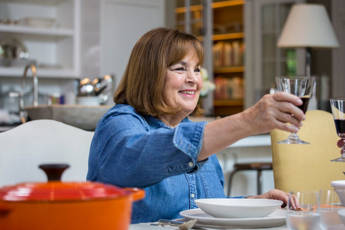 Ina Garten, the creator of many a Barefoot Contessa Easter menu, raises a glass wearing a blue shirt