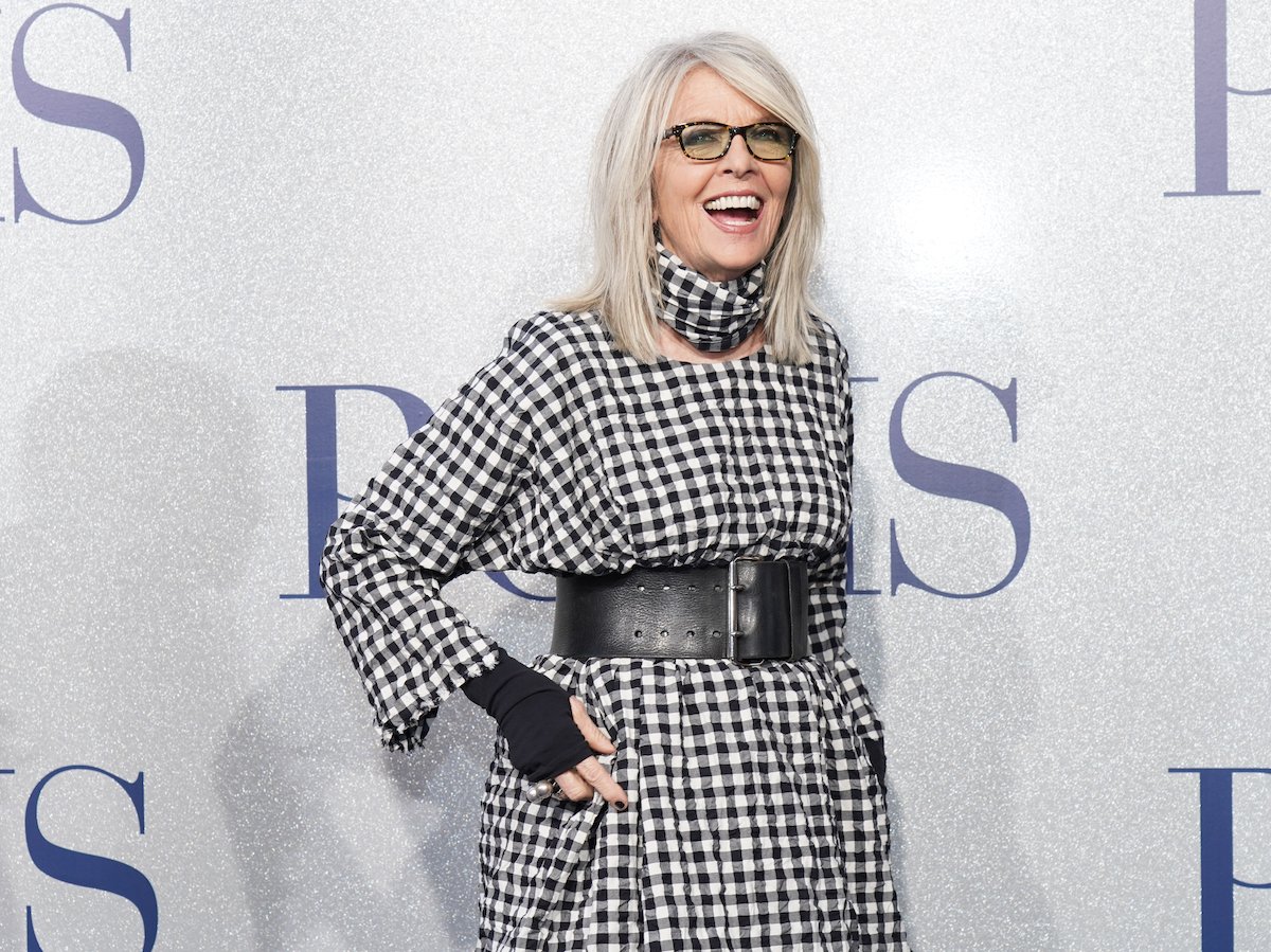 Diane Keaton smiling in front of a white background
