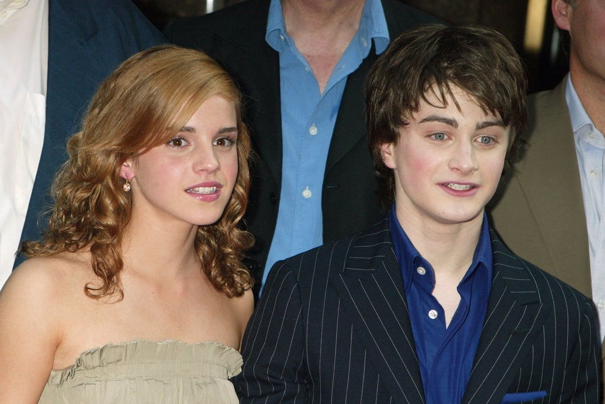 Emma Watson and Daniel Radcliffe smiling with each other.