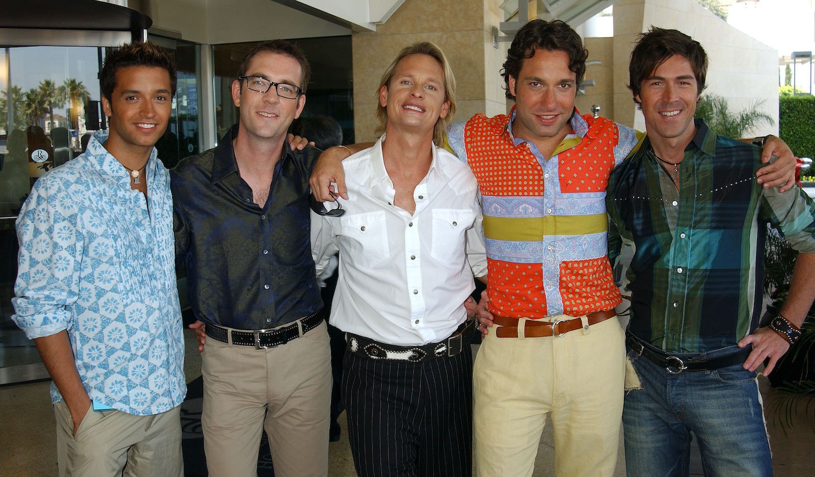 The cast of 'Queer Eye For The Straight Guy' stand and smile for a photo at the Renaissance Hollywood Hotel