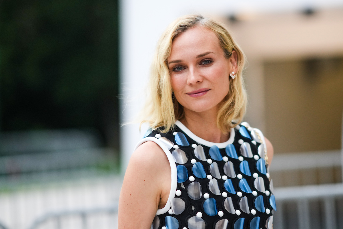Diane Kruger cuts a stylish figure in a white top, jeans and $3,250 Dior  handbag at grocery store