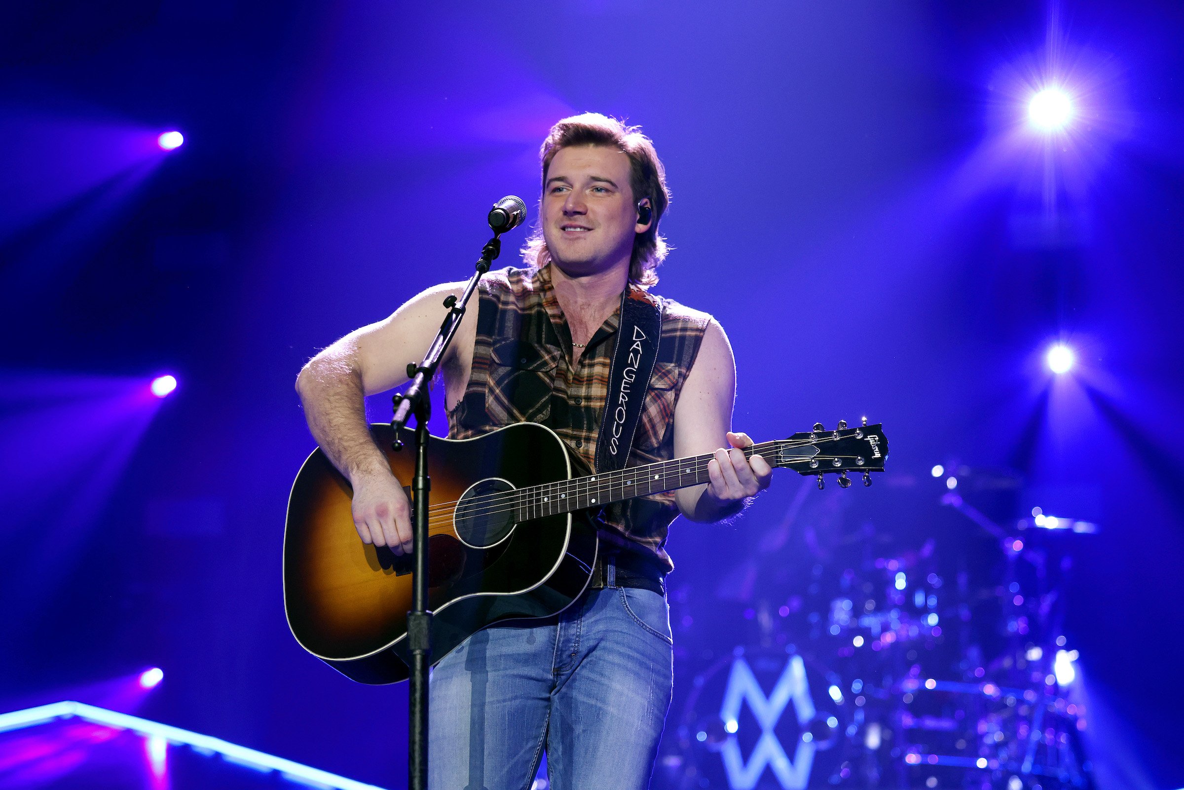 Morgan Wallen singing while playing guitar