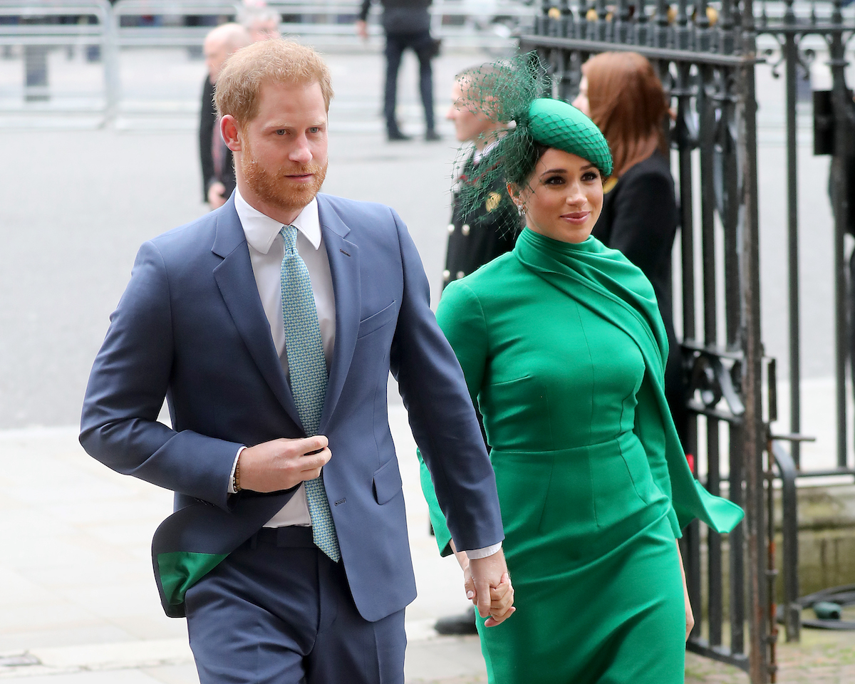 Prince Harry and Meghan Markle, whose Platinum Jubilee visit will make royals resent them, according to an expert, hold hands as they enter Westminster Abbey