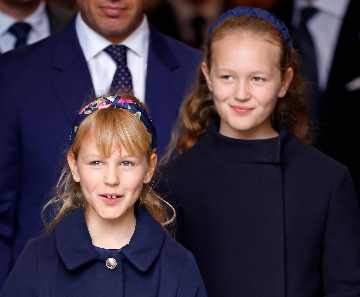 Isla Phillips and Savannah Phillips, who attended Lilibet's first birthday party, smile and look on