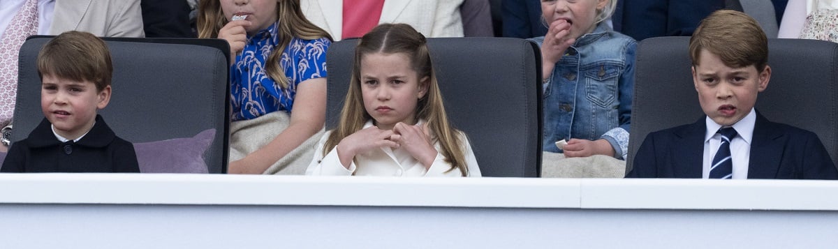 (L- R): Prince Louis, Princess Charlotte, and Prince George, whose body language shows their personality differences, watching the Platinum Pageant