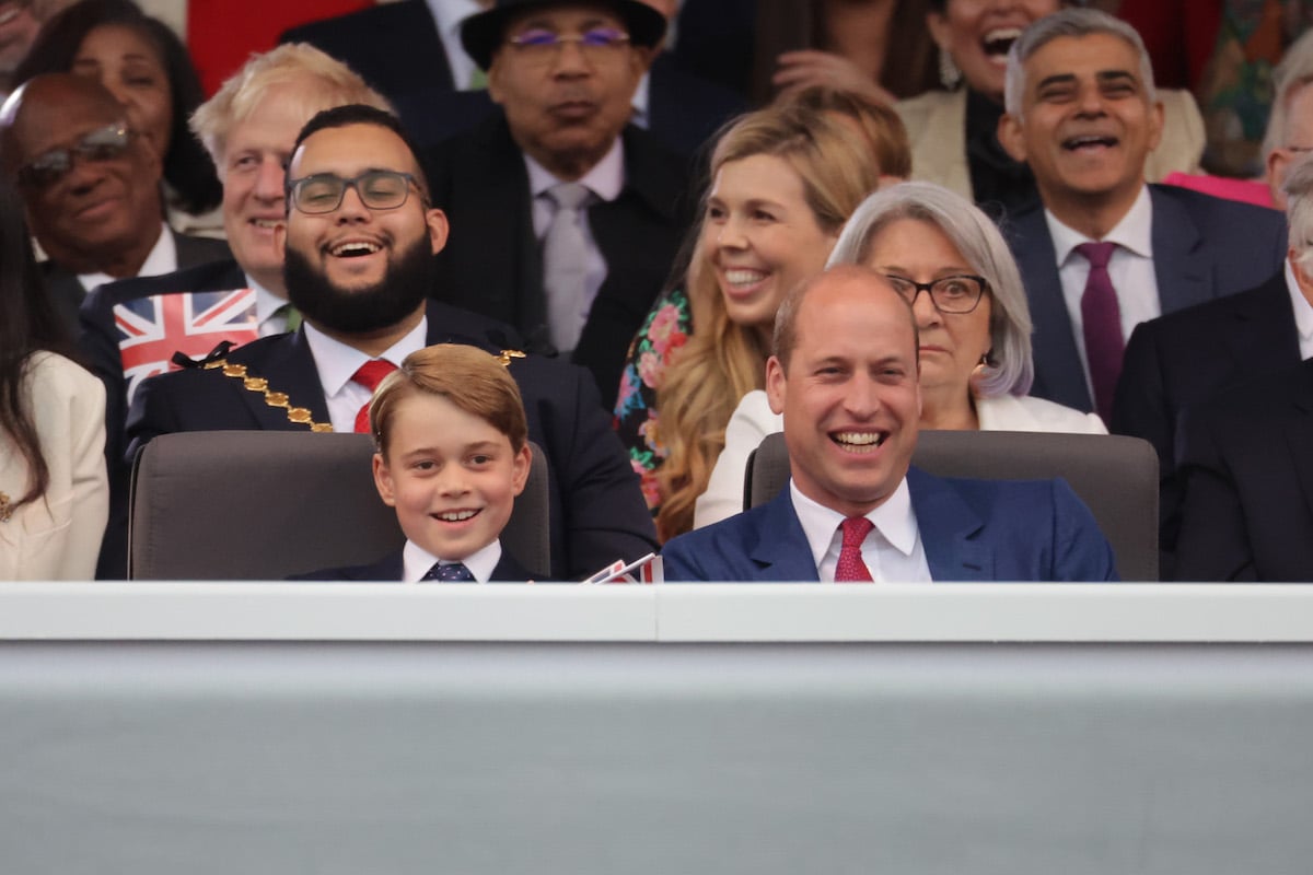 Prince George and Prince William, who sang along to 'Sweet Caroline,' look on at a concert during Platinum Jubilee weekend