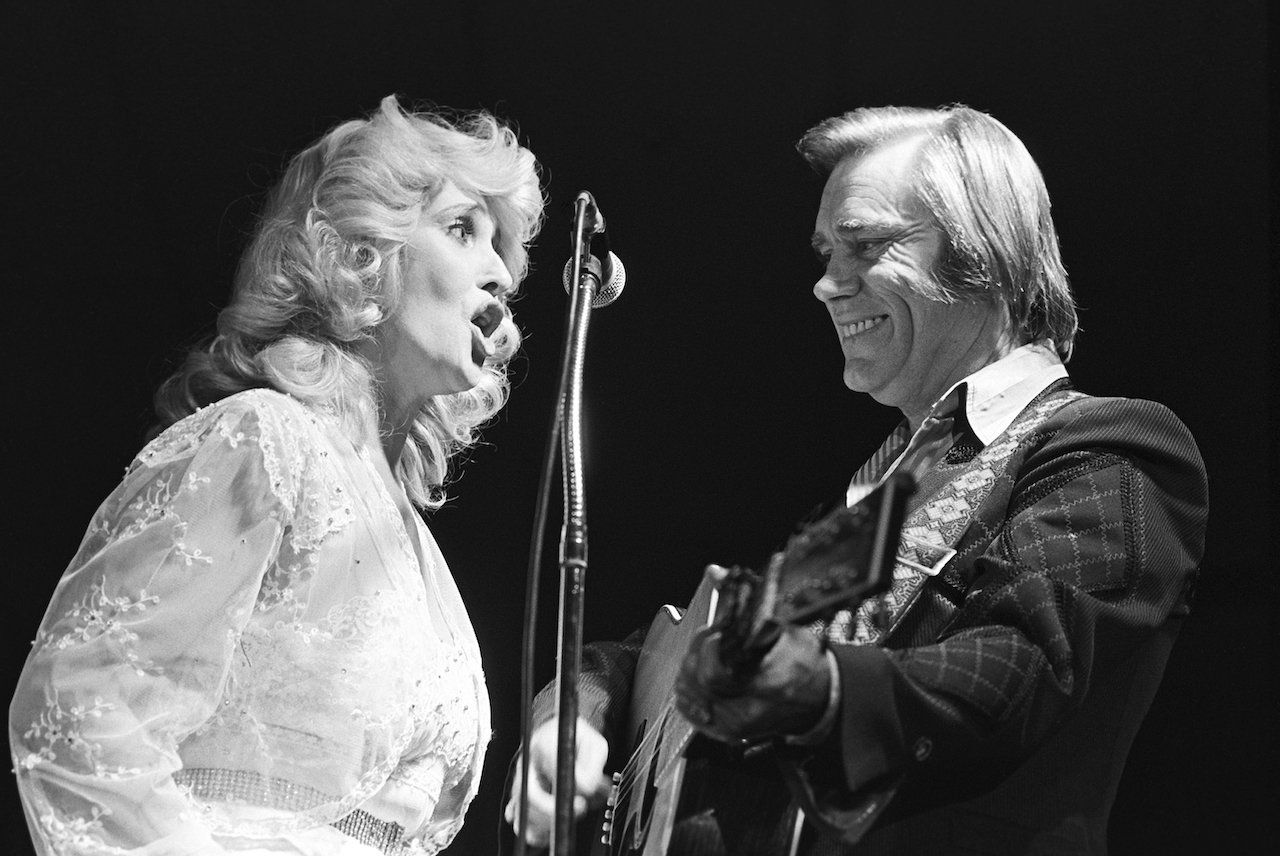 Tammy Wynette claimed George Jones, shown on stage together in 1980, once chased her with a loaded rifle during their marriage