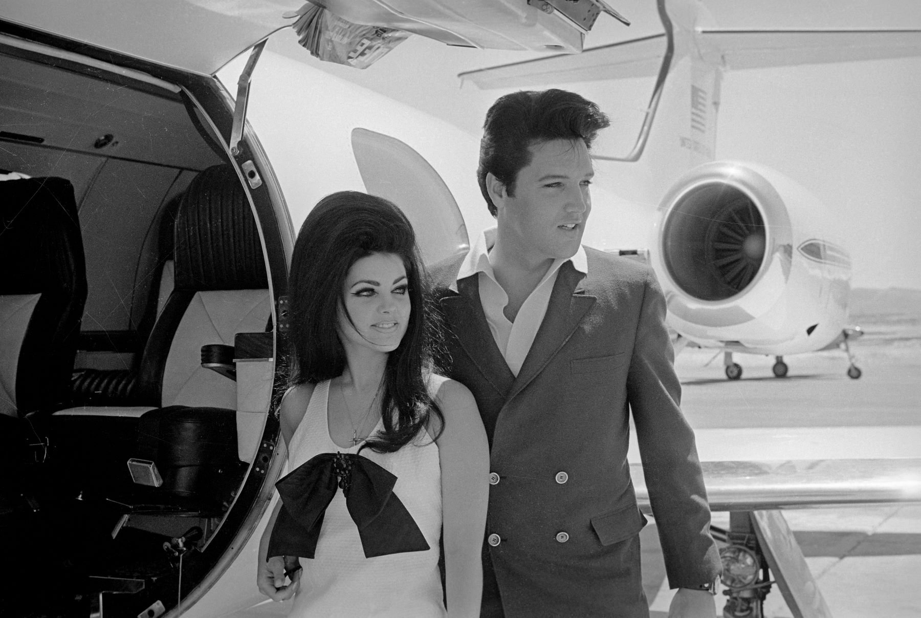 Elvis Presley and Priscilla Presley boarding a private plane after their wedding in Las Vegas, Nevada