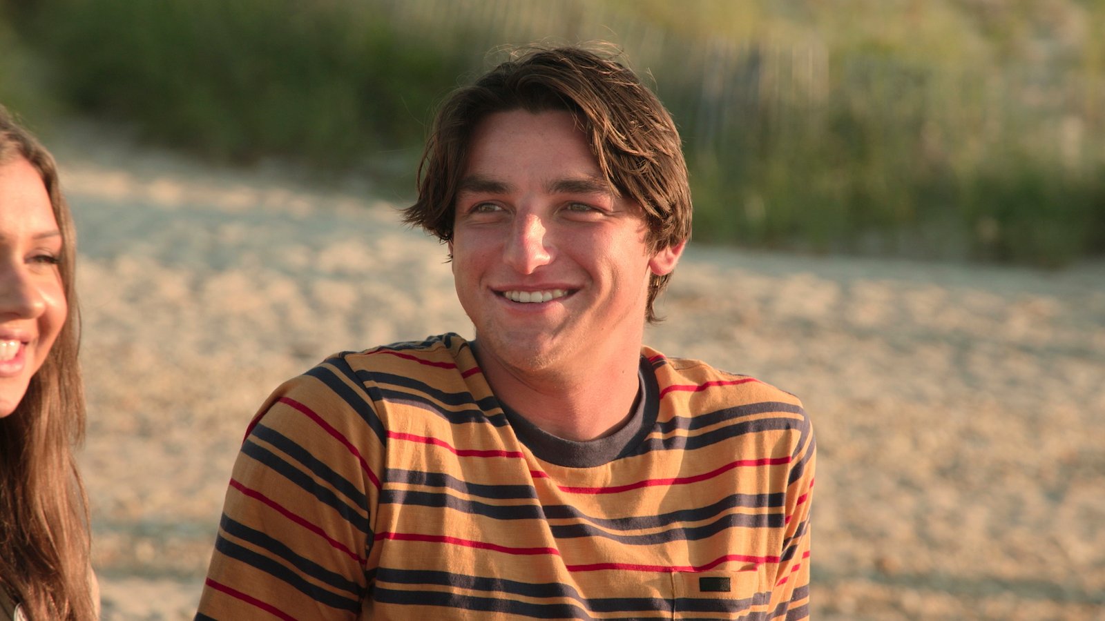 Frankie Hammer smiles on the beach on Forever Summer: Hamptons