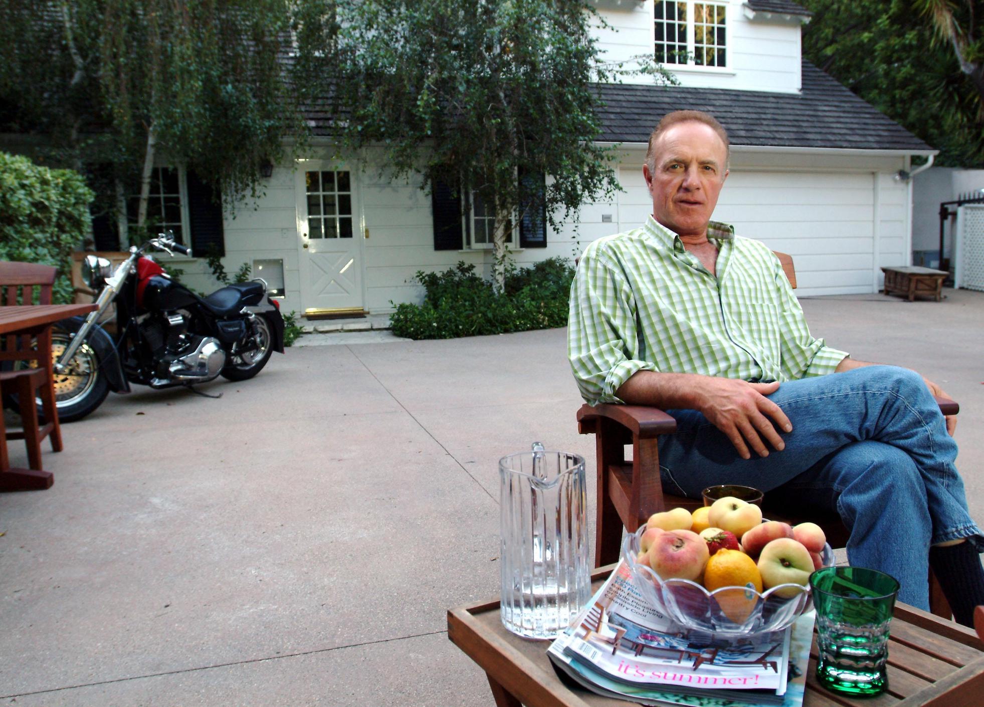 James Caan sitting outside of his home in a chair