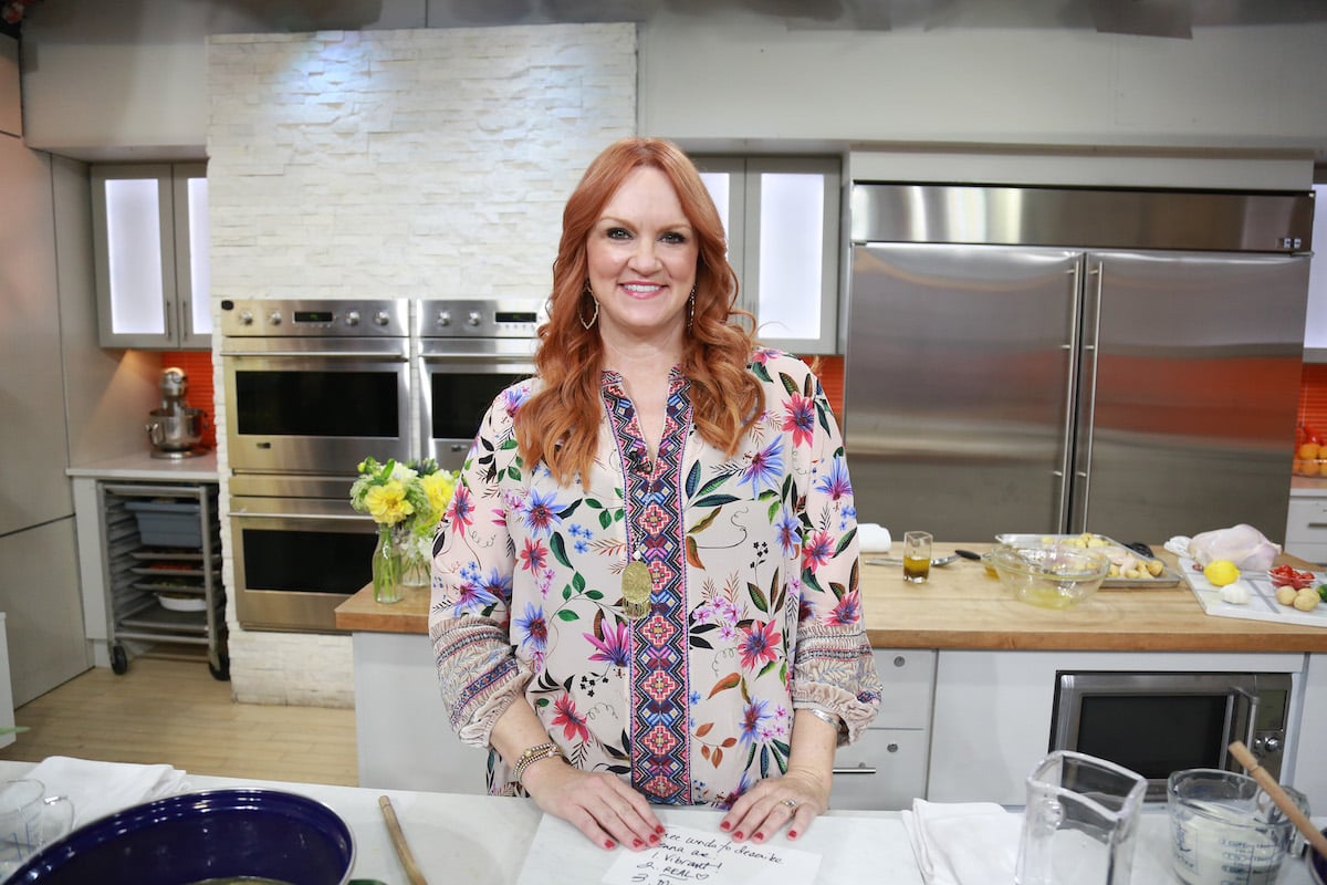 Ree Drummond, who has a citrus salmon skewers recipe, smiles wearing a printed top
