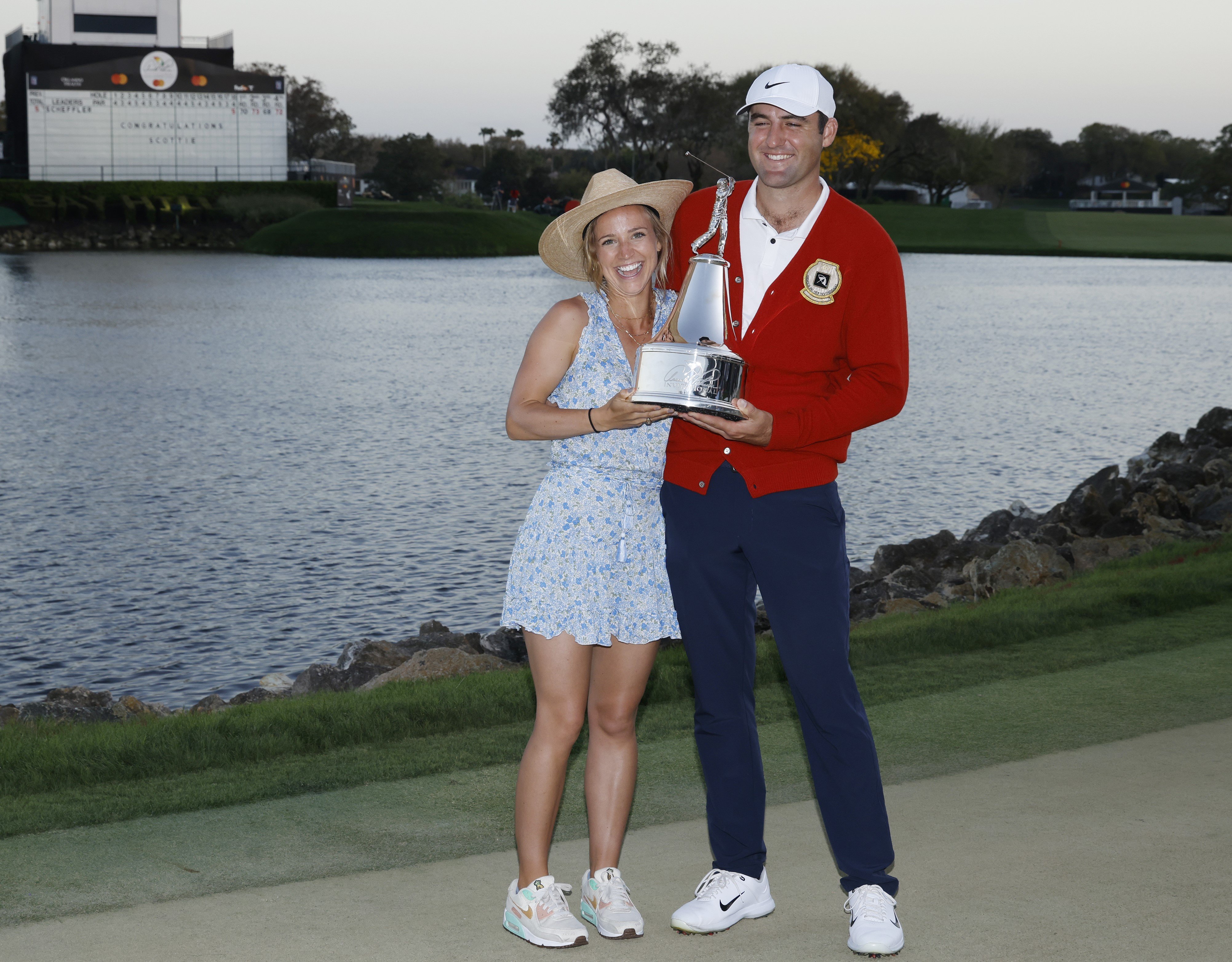 How Scottie Scheffler Met His Wife Meredith Scudder   Scottie Scheffler Holds Trophy Along With Wife Meredith Scudder After Winning The Arnold Palmer Invitational 