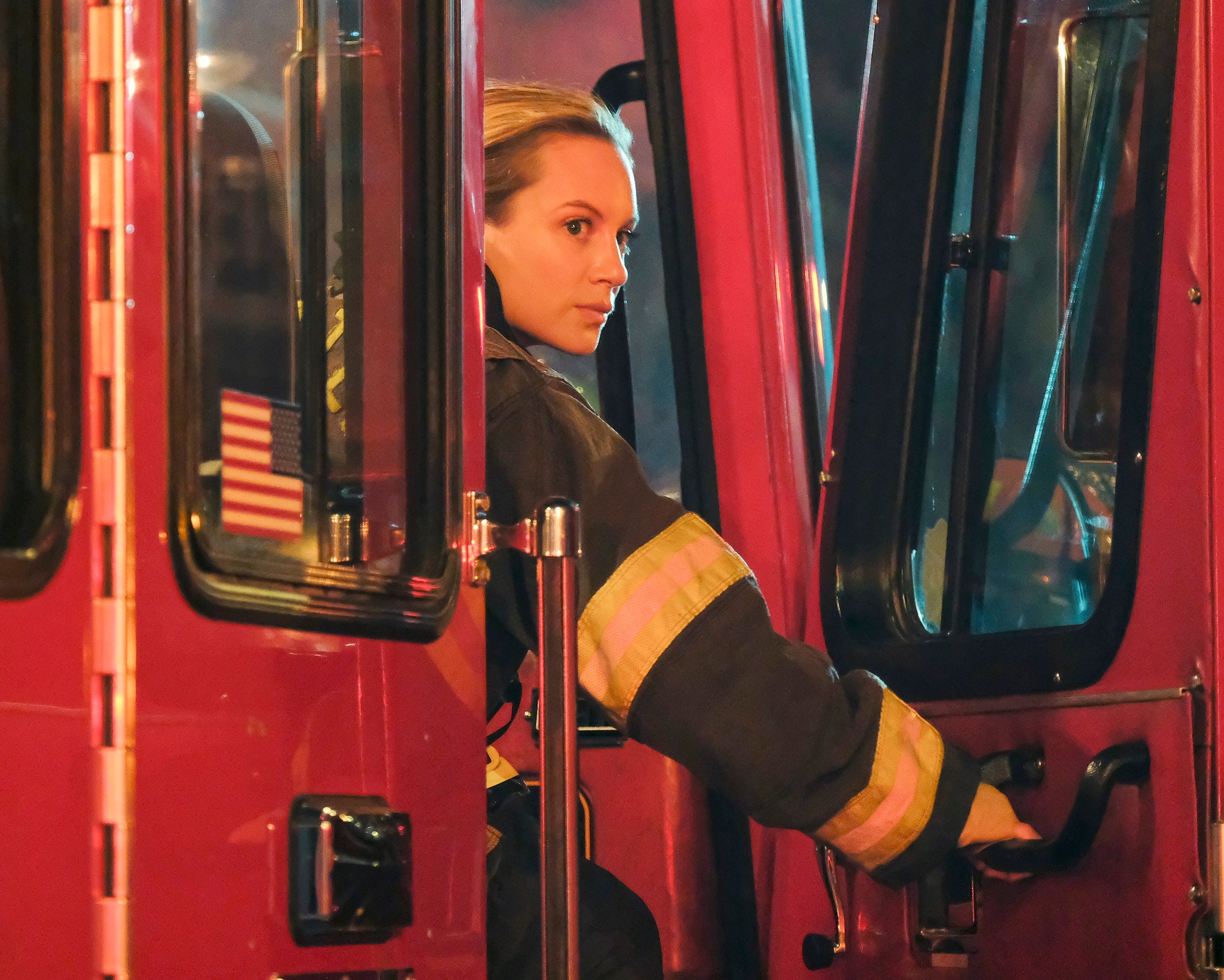 'Station 19' star Danielle Savre as Maya Bishop looking out the door of a fire engine
