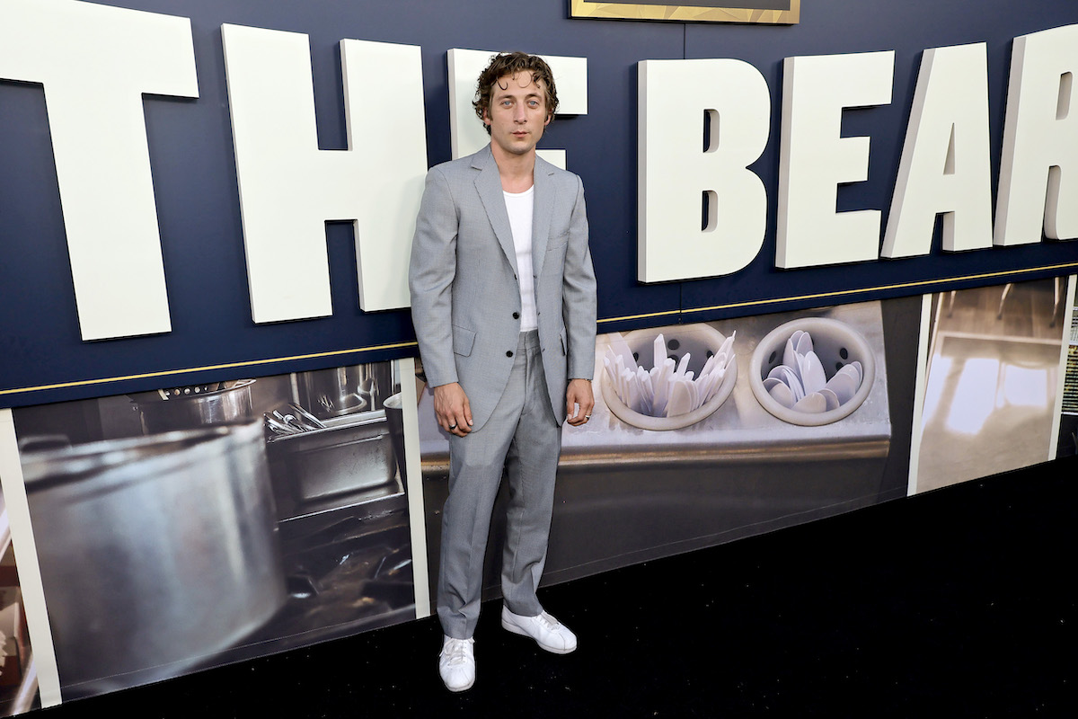 Jeremy Allen White attends the Los Angeles premiere of FX's 'The Bear,' posing in a light gray suit.