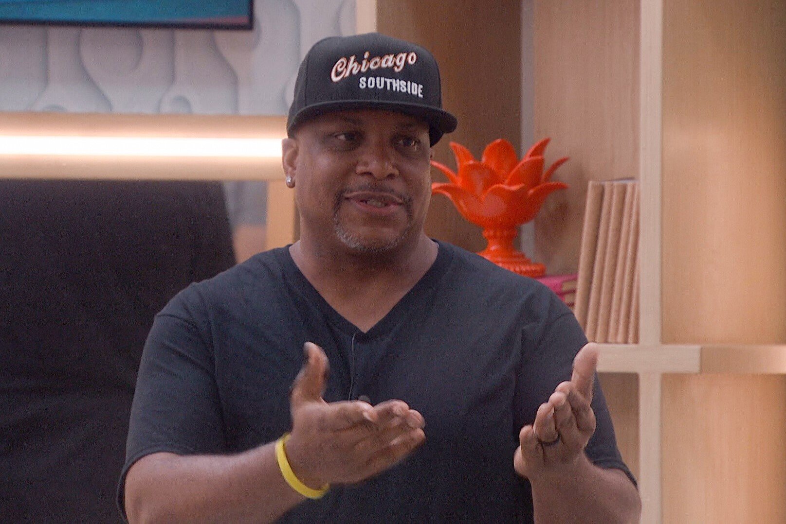 Terrance Higgins, who is a houseguest in 'Big Brother 24' on CBS, wears a black shirt and a black cap that says 'Chicago Southside.'