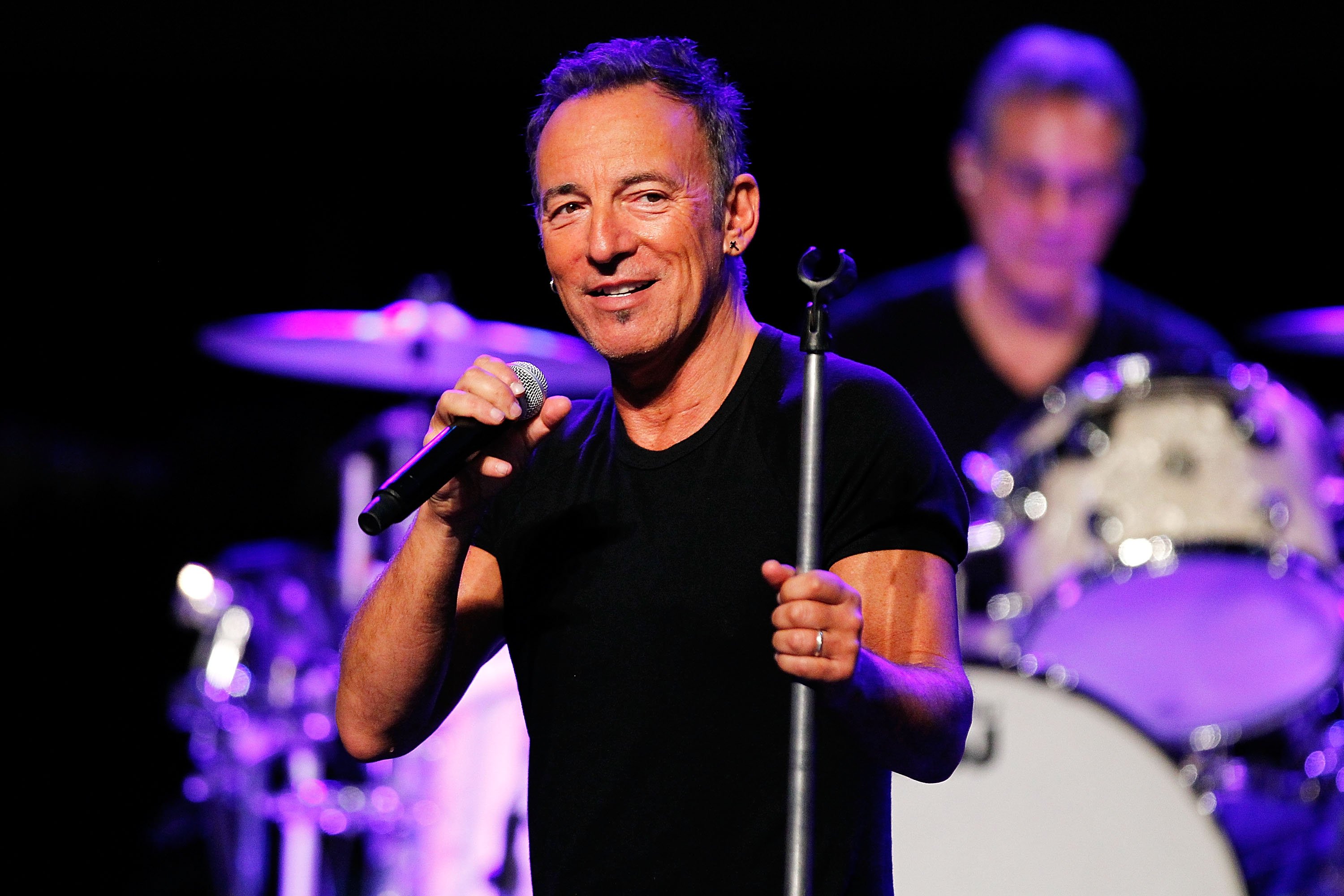 Bruce Springsteen performs at a sound check before speaking to media during a press conference