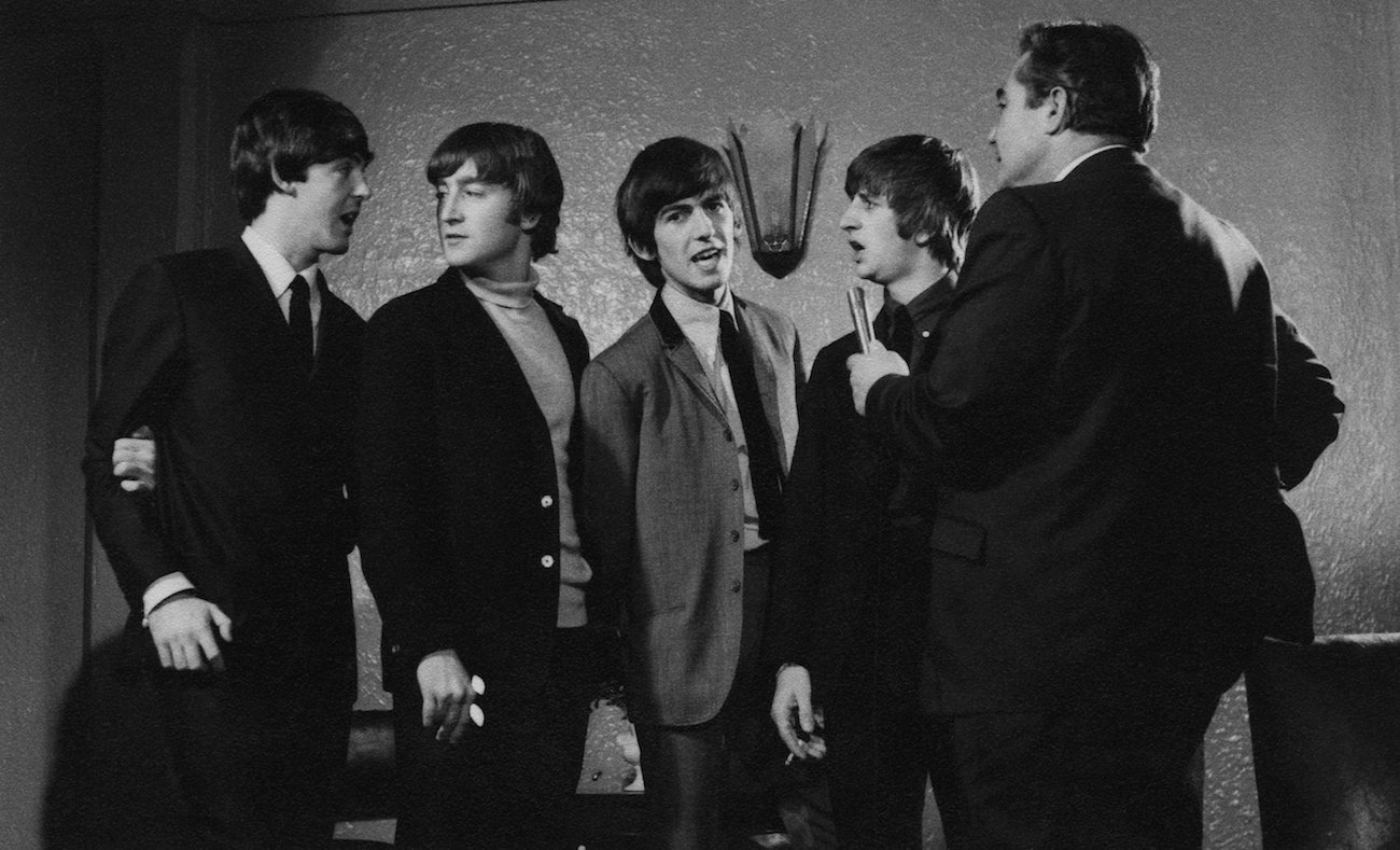 George Harrison with The Beatles during one of their interviews in 1964.