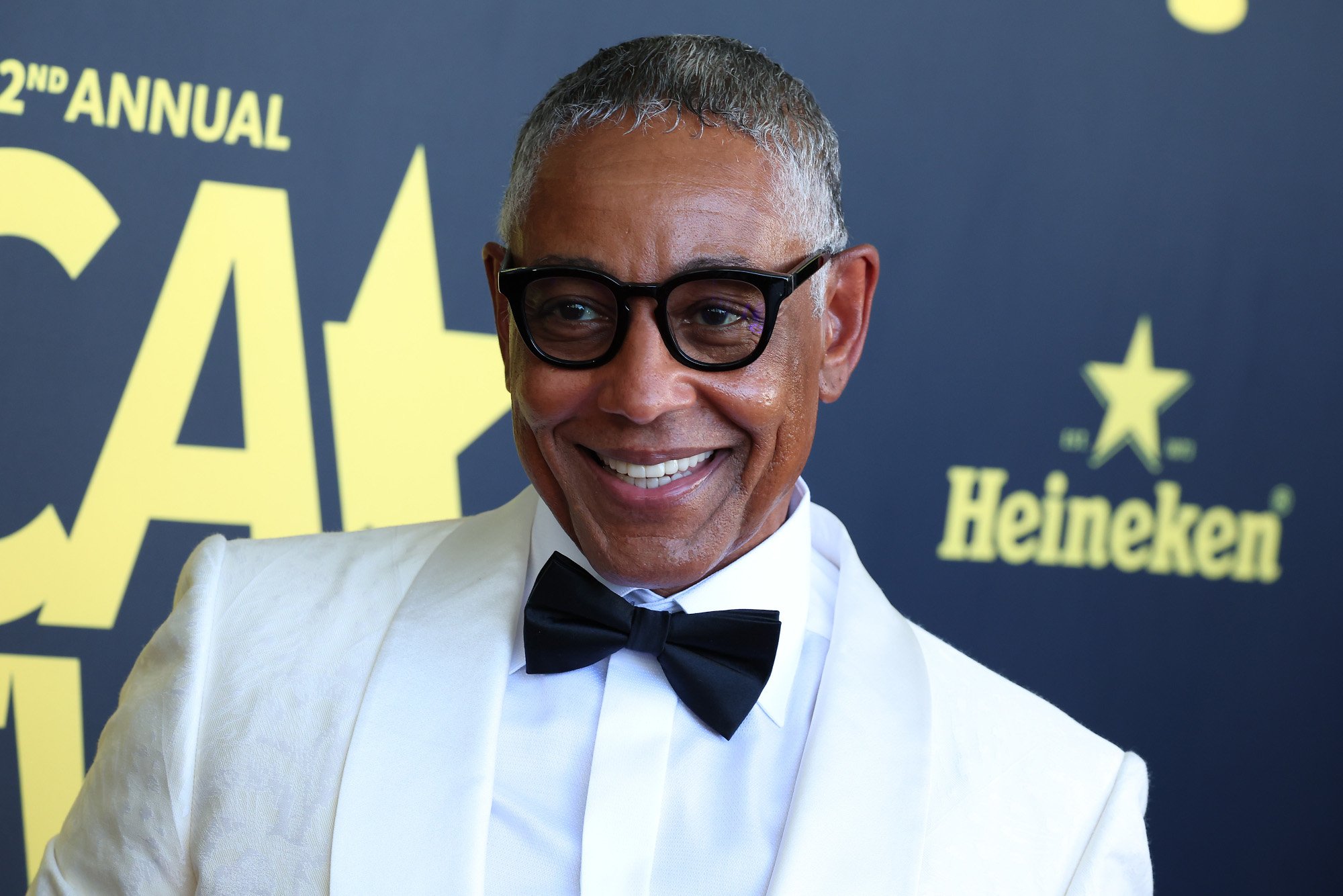 'Better Call Saul' cast member Giancarlo Esposito. He's wearing a white suit, black bowtie, and glasses.