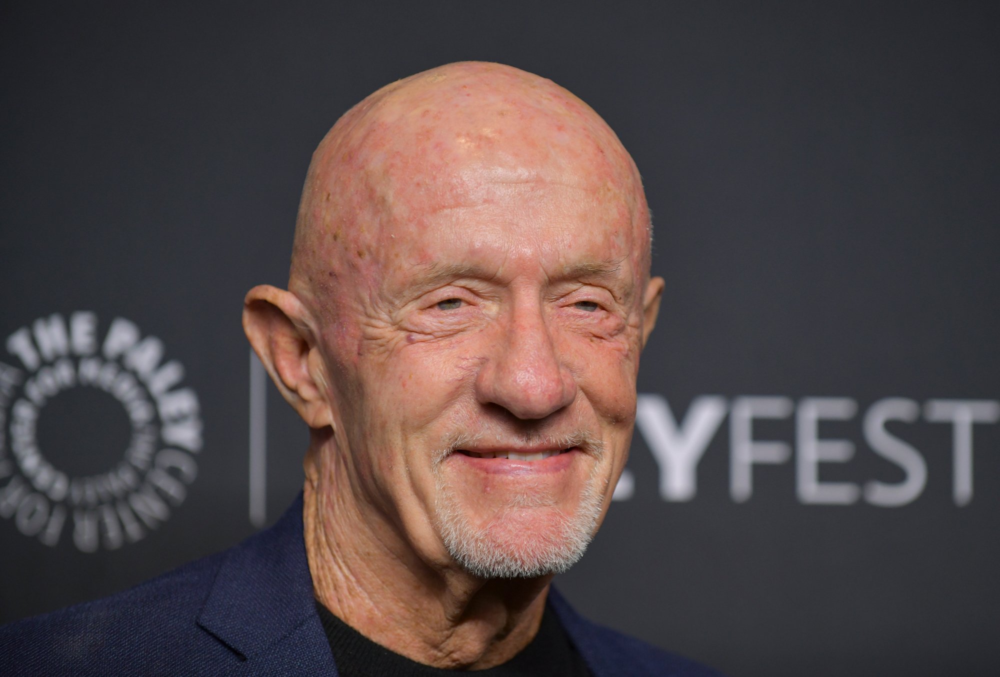 'Better Call Saul' cast member Jonathan Banks. He's wearing a dark blue shirt and smiling.