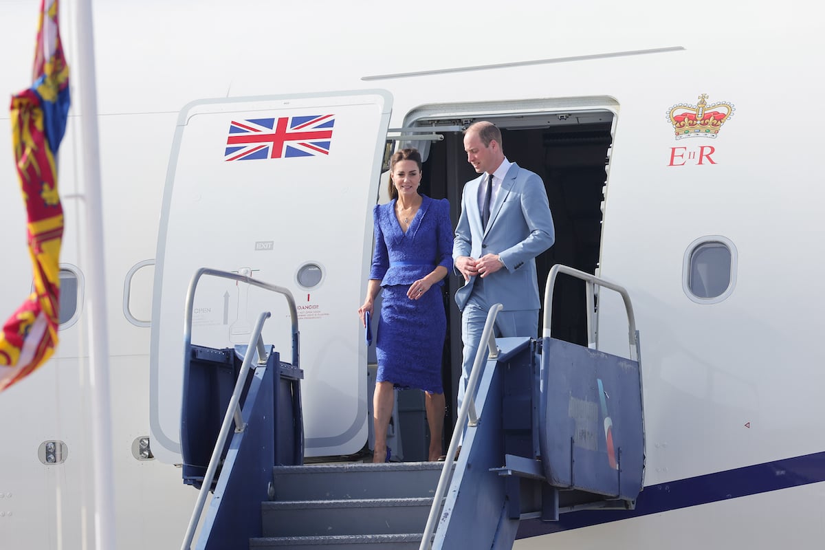 Kate Middleton, who reportedly has a plane seat for her dresses, walks off a plane with Prince William