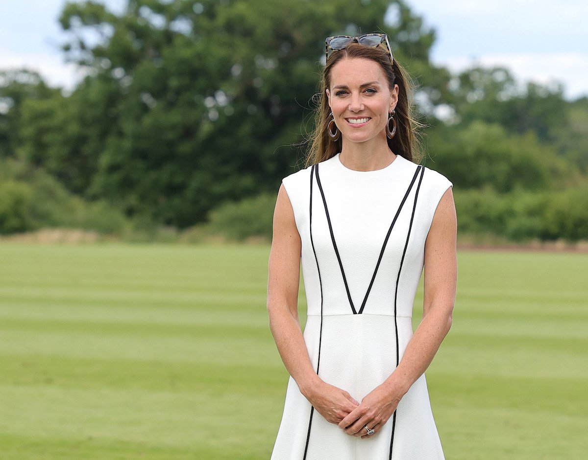 Kate Middleton, who reportedly has an airplane seat for her dresses, wears a dress at a polo match