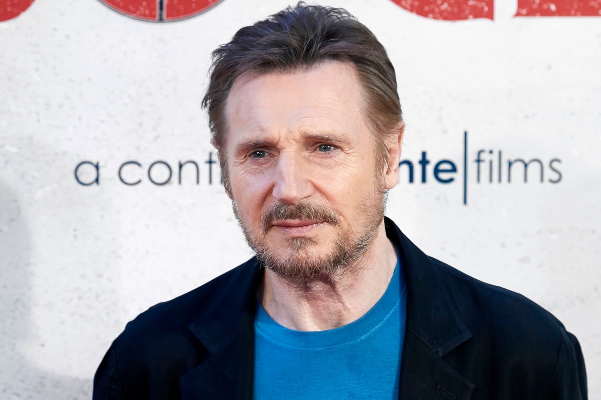 Liam Neeson posing.