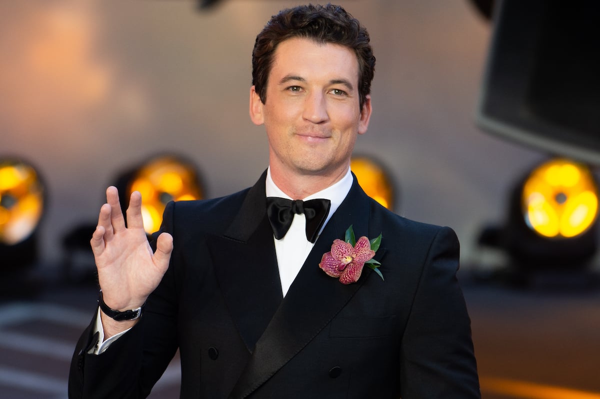 Miles Teller smiling and waving