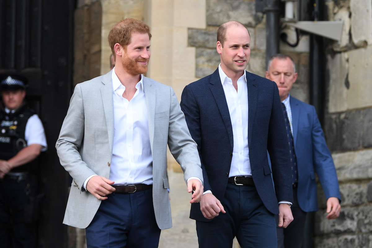 Prince Harry and Prince William, who 'were never really good friends,' smile as they walk next together