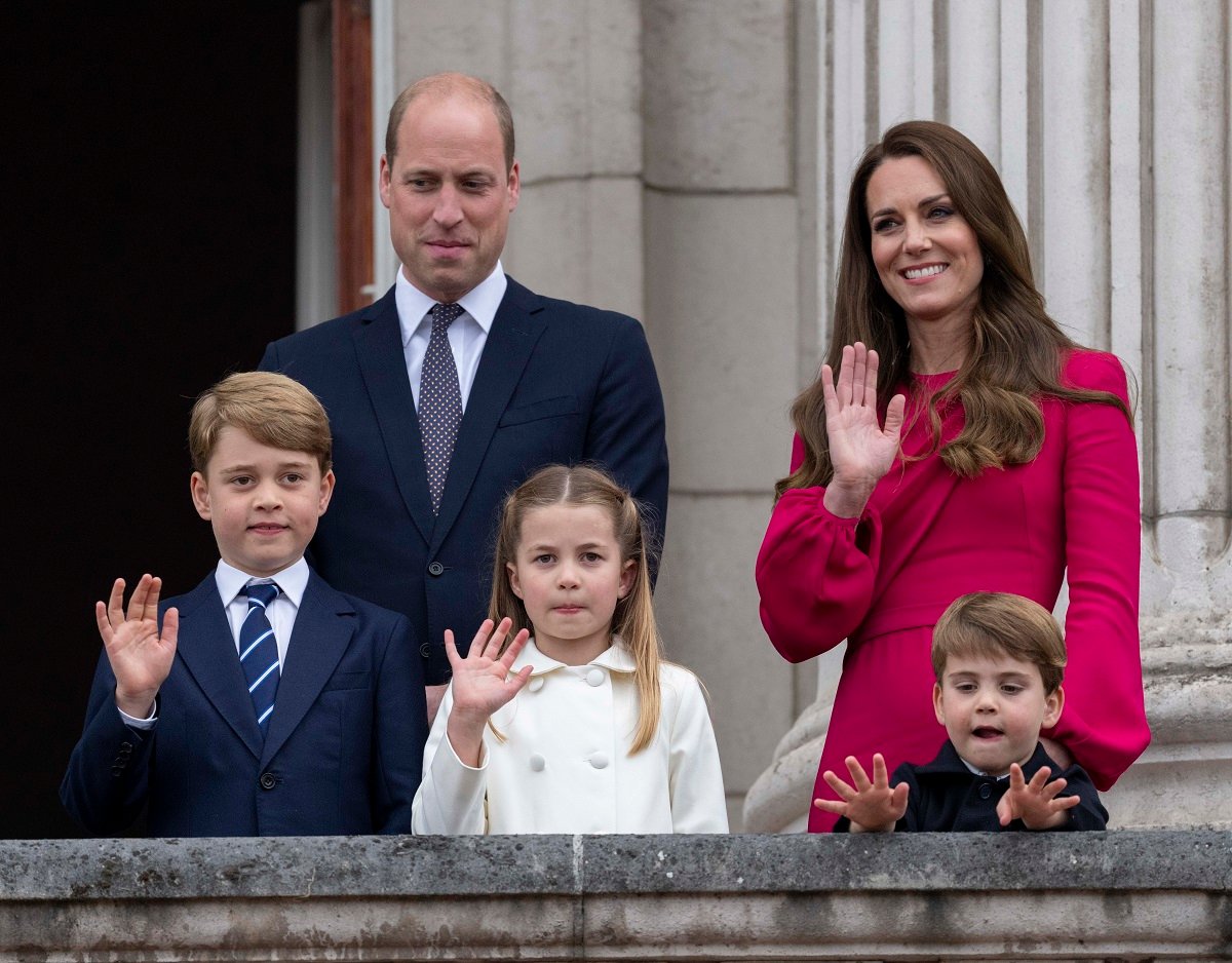 Prince William standing on the balcony at Buckingham Palace with his wife, Kate Middleton, and their children Prince George, Princess Charlotte, and Prince Louis 