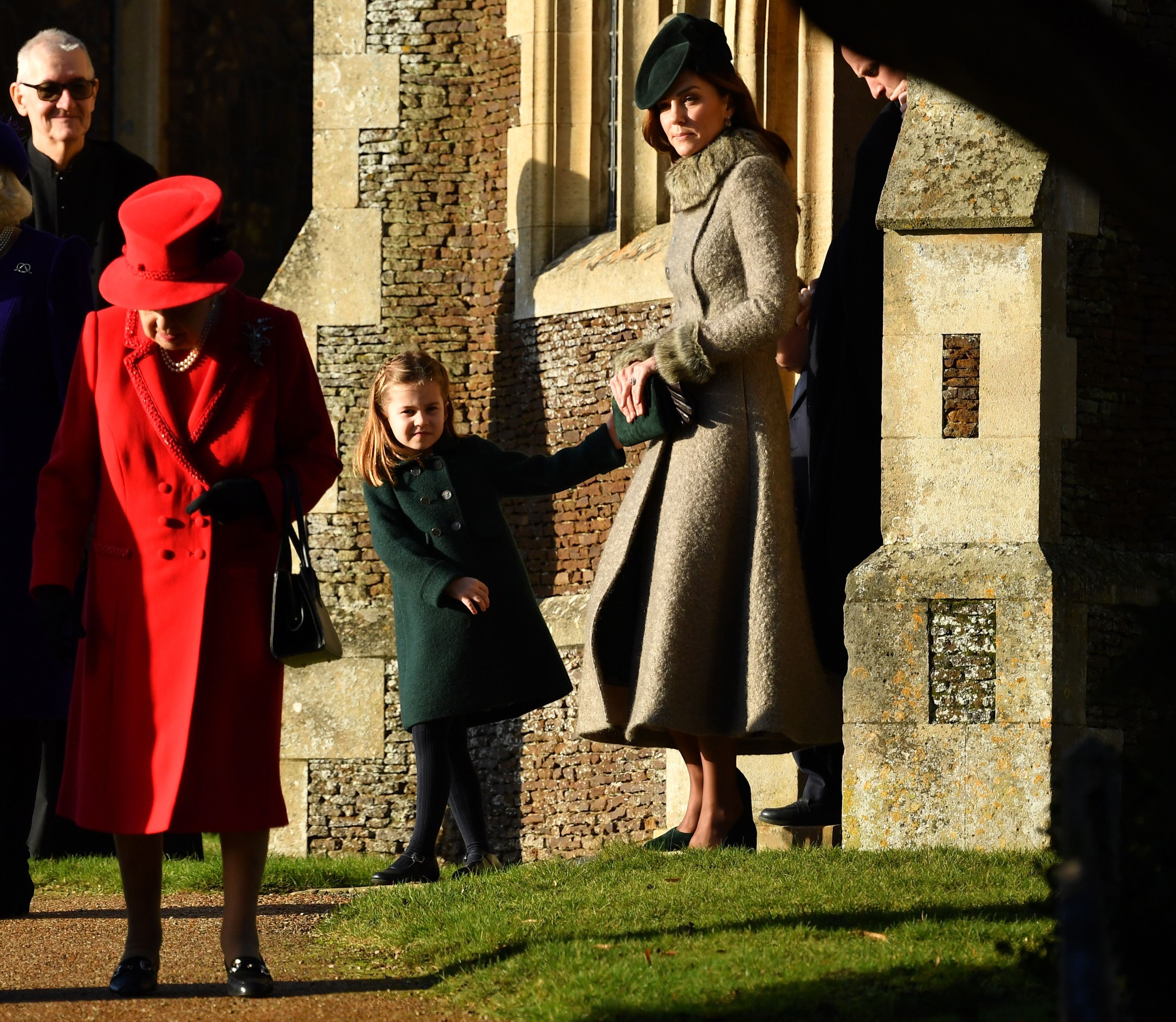 Queen Elizabeth II, Kate Middleton, and Princess Charlotte leave the Royal Family's traditional Christmas Day service