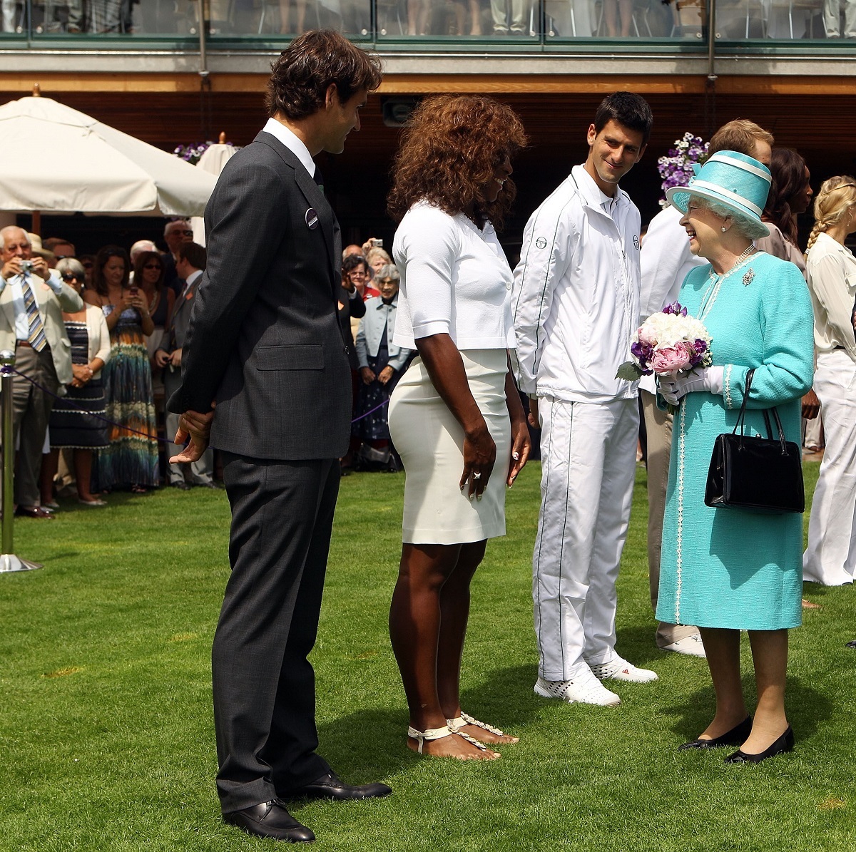 Queen Elizabeth II meets (L-R) Roger Federer, Serena Williams, Novak Djokovic, Andy Roddick, Venus Williams and Caroline Wozniacki as she attends the Wimbledon Lawn Tennis Championships