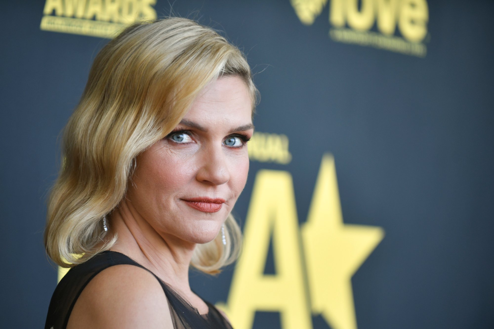 'Better Call Saul' cast member Rhea Seehorn. She's wearing a black dress and her blonde hair is down.