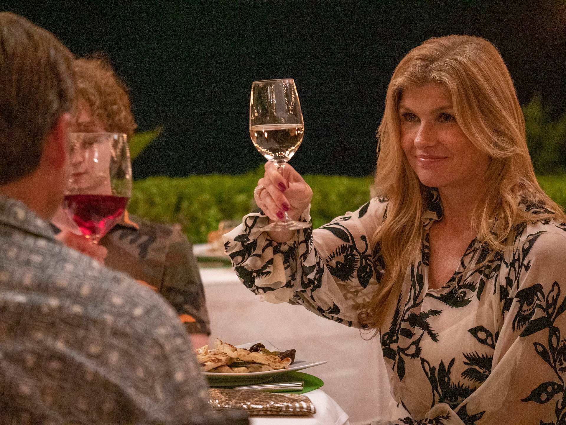 'The White Lotus' Episode 2: Connie Britton as Nicole Mossbacher raising a glass