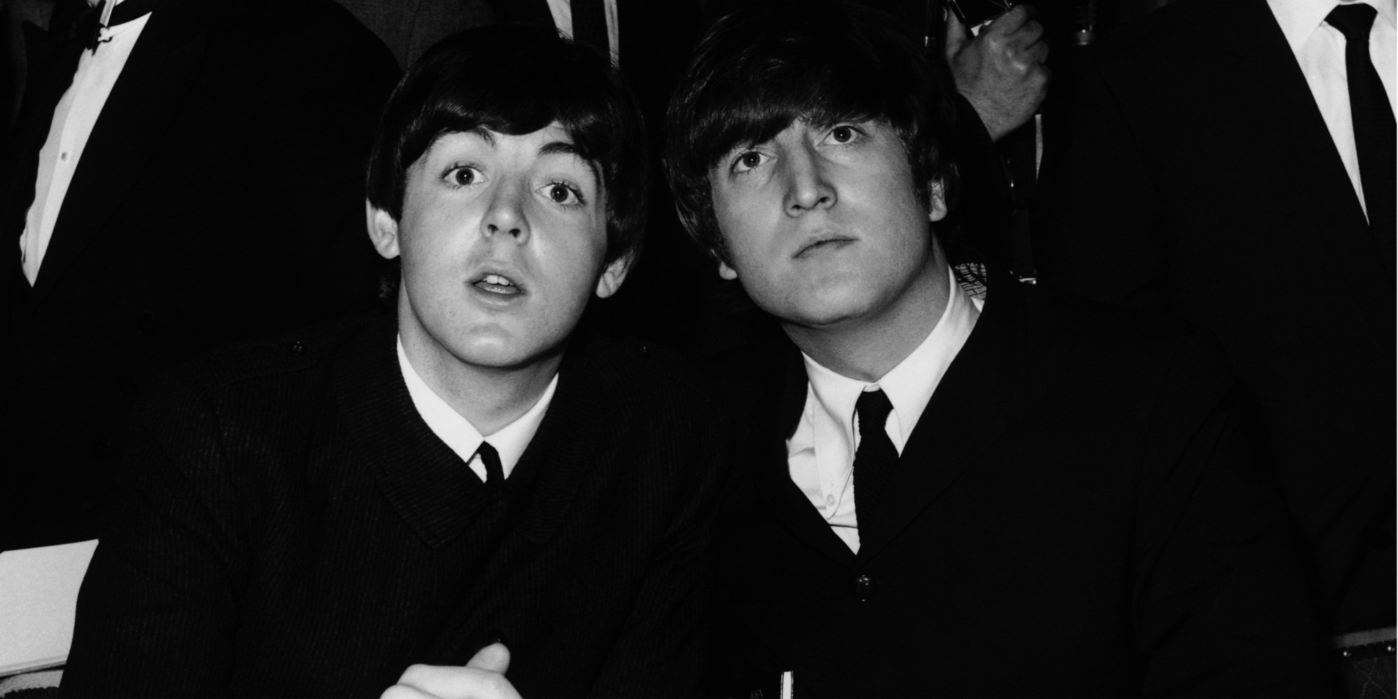 John Lennon and Paul McCartney pose together in a photograph taken in 1964.