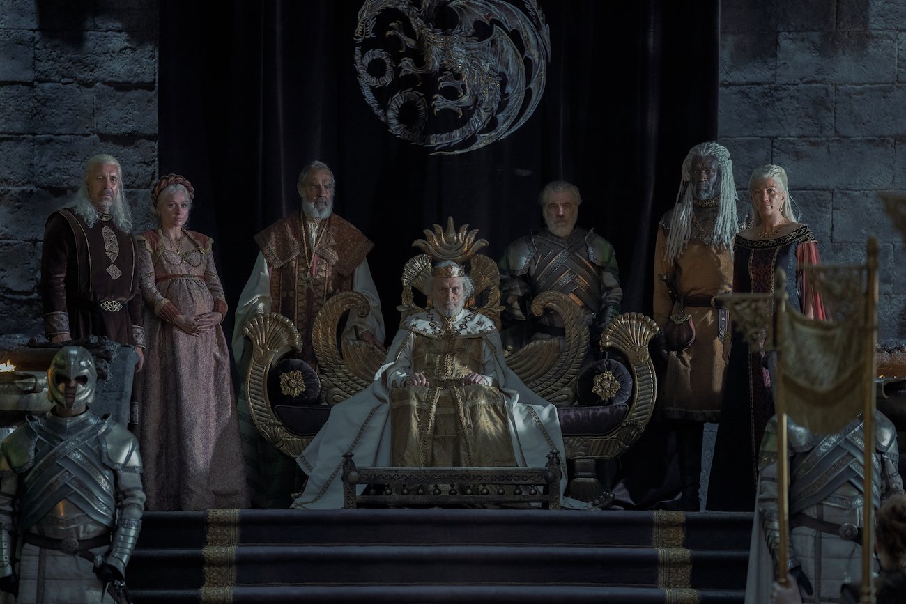 Viserys (Paddy Considine), Aemma (Sian Brooke), Jaehaerys Targaryen (Michael Carter), Corlys Velaryon (Steve Toussaint), and Rhaenys Targaryen (Eve Best) stand around the Iron Throne in the 'House of the Dragon' premiere