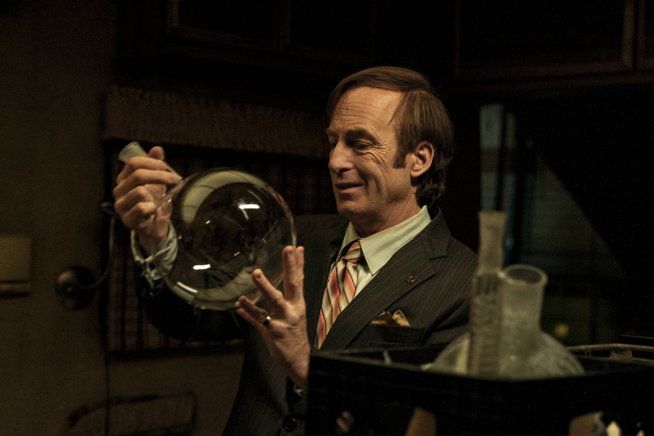 Saul Goodman (Bob Odenkirk) examines science equipment in 'Better Call Saul' Season 6 Episode 11 'Breaking Bad'