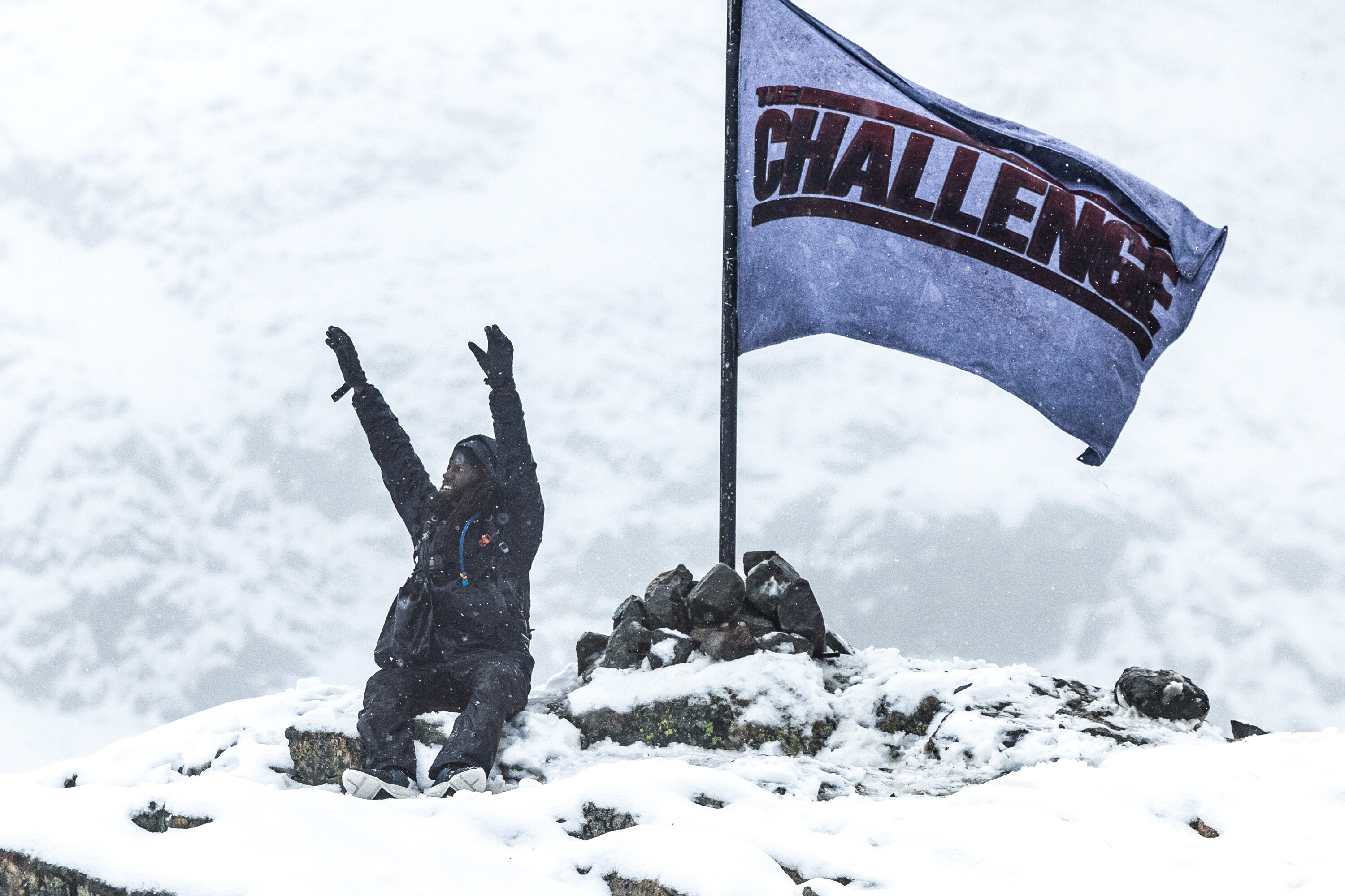 Danny McCray celebrating his win next to 'The Challenge USA' flag