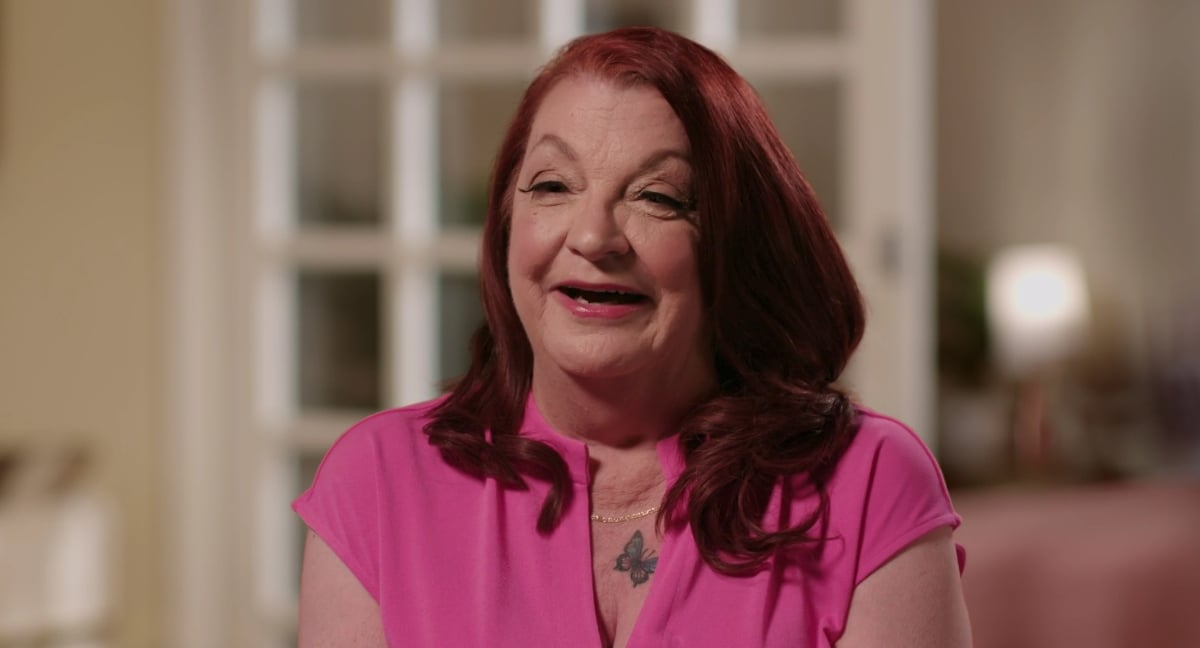 Debbie Johnson wearing a pink shirt and smiling on the premiere of'90 Day: The Single Life' Season 3 on discovery+.