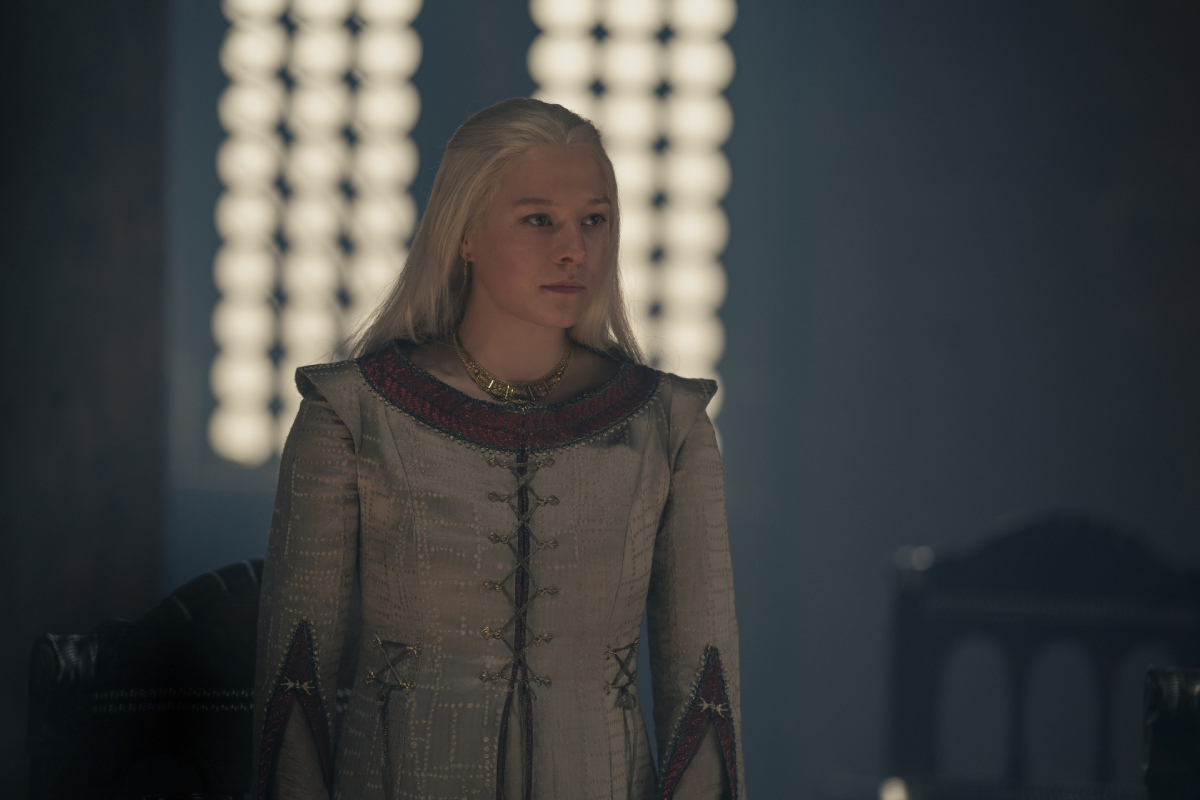 Daemon and Rhaenyra have an uncomfortable relationship in House of the Dragon. Emma D'Archy as adult Rhaenyra wears a grey and red dress.