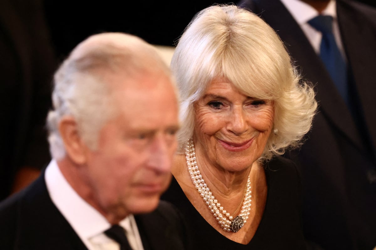 King Charles and Camilla Parker Bowles, who is according to a body language expert avoiding certain 'body language upgrades' look on