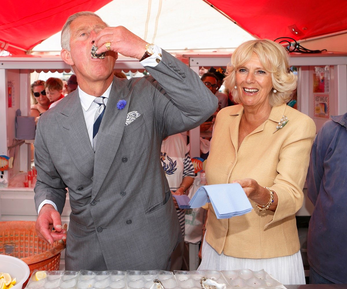  King Charles and Camilla, Queen Consort, whose favorite foods say a lot about their personalities according to a body language expert, at an Oyster Festival