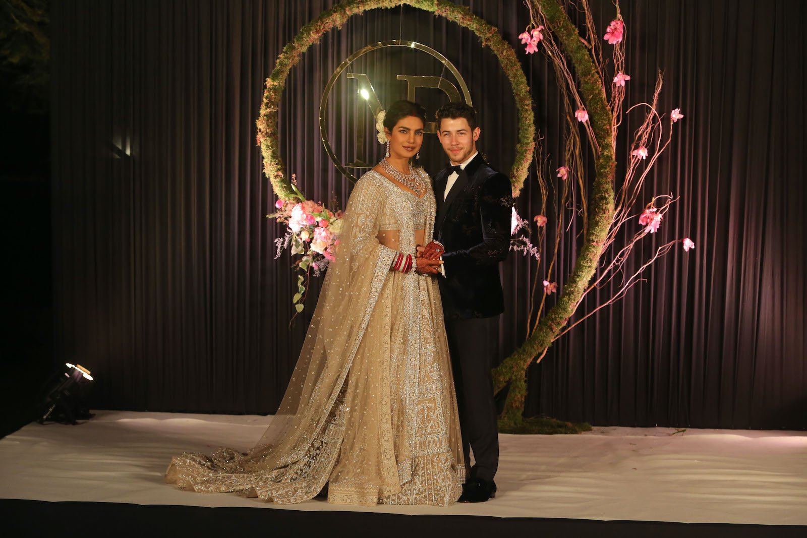 Priyanka Chopra and Nick Jonas pose for a photo at their wedding reception