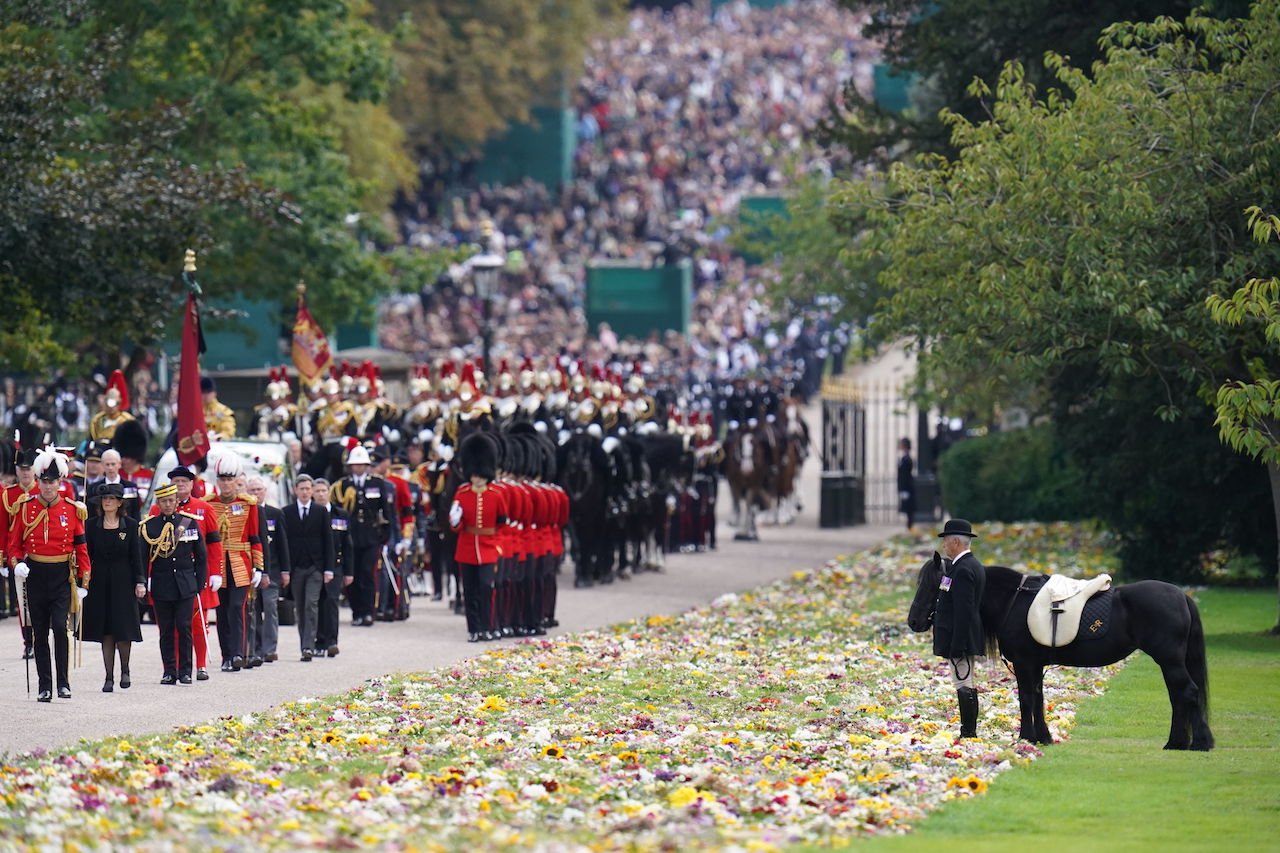 Emma, Queen Elizabeth's fell pony, stands by the Ceremonial Procession of the coffin of Queen Elizabeth II.