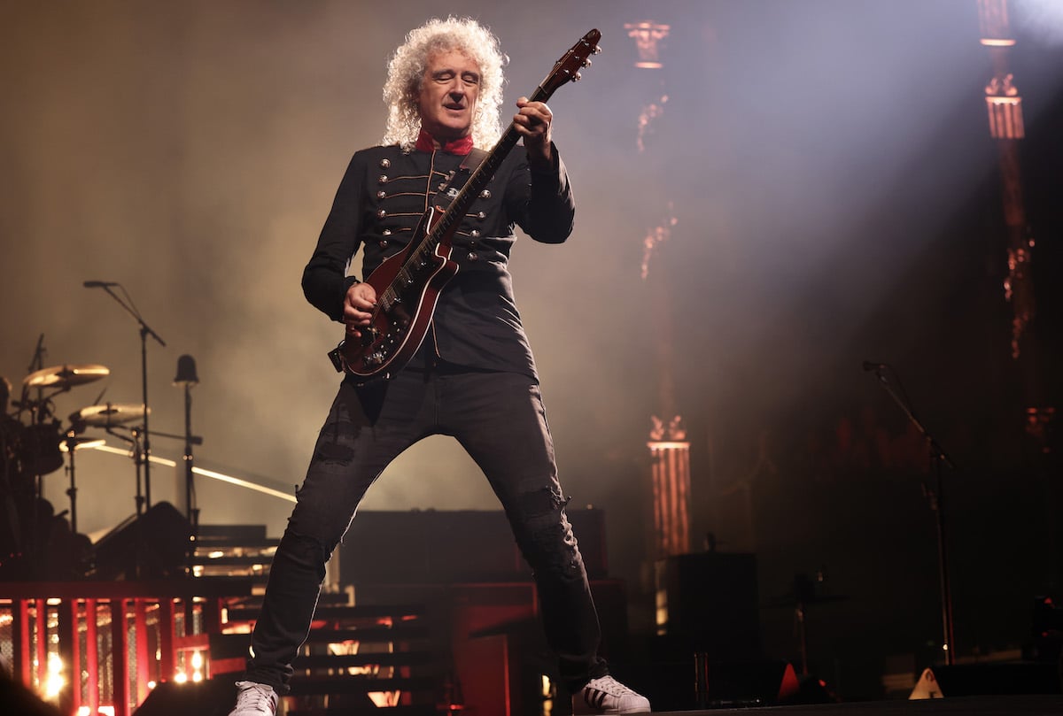 Queen member Brian May performing on stage